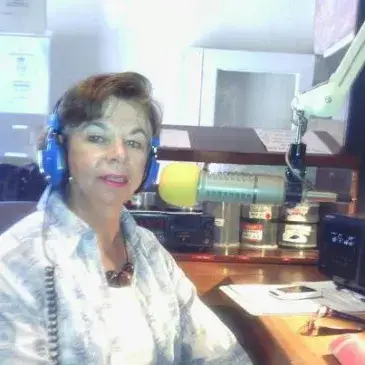 Stephanie L. Mann recording in a radio studio